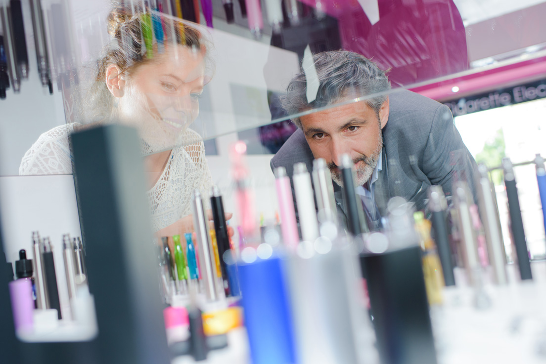 man and woman shopping for a vape pen. 