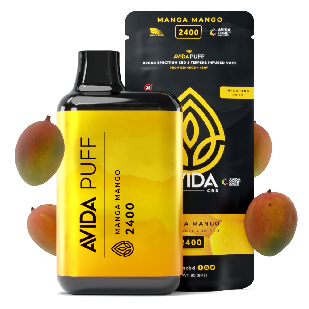 Avida Puff Manga Mango 2400mg CBD vape pen paired with its packaging, surrounded by fresh mangoes, highlighting its tropical flavor.