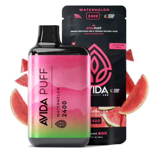 AVIDA Puff Watermelon 2400mg CBD vape with vibrant packaging, complemented by fresh watermelon slices, highlighting a nicotine-free, terpene-infused pen.